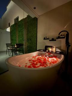 Cozy Escape Bathtub Patio Seating 65 inch TV - 0