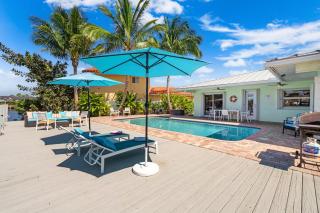 Waterfront Home with Heated Pool and Sunset Views - 4