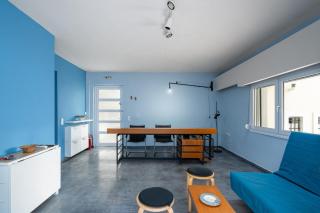 The blue house with the yard - 1