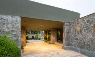 ELIVAAS Signature Stone Age home 4-BHK Stone-Clad Villa with Private Pool, Terrace Garden & Gazebo - 1