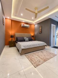 Modern 1BHK in Bahria Town Lahore with TV Lounge - 7