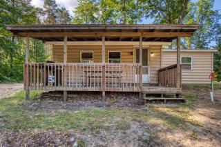 Cozy Log Cabin with Dock, Kayaks, Firepit, AC, minutes to Ludington and Lake MI - 0