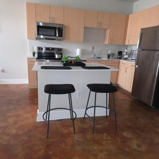 Modern Industrial Condo with Private Garage Queen Bed Workspace In-Unit Laundry - 3