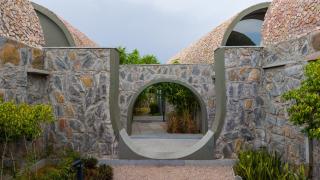 ELIVAAS Signature Stone Age Home Fernwood 6-BHK Stone-Clad Estate with Bamboo Cottages, Private Pool, Gazebo & Terrace Garden - 1