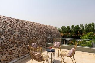 ELIVAAS Signature Stone Age Home Fernwood 6-BHK Stone-Clad Estate with Bamboo Cottages, Private Pool, Gazebo & Terrace Garden - 3