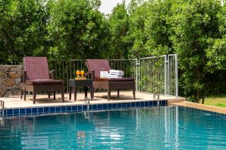 ELIVAAS Signature Stone Age Home Fernwood 6-BHK Stone-Clad Estate with Bamboo Cottages, Private Pool, Gazebo & Terrace Garden - 9