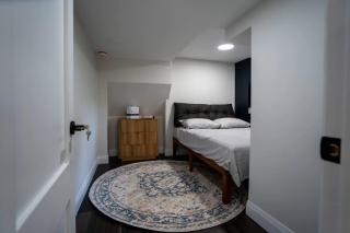 Modern 3BR Basement Retreat with Workspace & Parking - 2