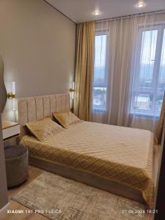 Cozy apartment with views of the mountains and Lake Sairan - 0