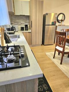 serene stays apartment with fully equipped gym , heated swimming pool ,private parking space and amazing scenic views - 6