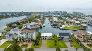Canal-front home with pool 40' boat slip gated beach access - 1 block to sand - 8