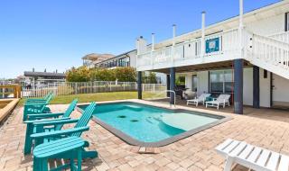 Canal-front home with pool 40' boat slip gated beach access - 1 block to sand - 6