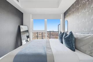 Sleek 2BR Condo with Private Patio & Parking - 9