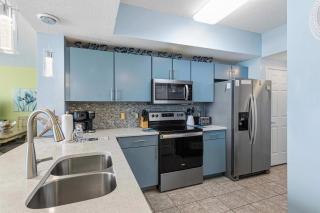Waters Edge 211 Beach Happy- 2nd Floor Waterfront Condo with Central AC Washer&Dryer & Shared Pools - 1