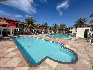 Casas no Residencial Mont Sinai com 2 ou 3 suítes (todas com ar), internet privativa 300MBPS a aproximadamento 250m da Praia de Taperapuã, condomínio com piscinas adulto e infantil, sauna, churrasqueiras e Segurança 24hrs. - 6