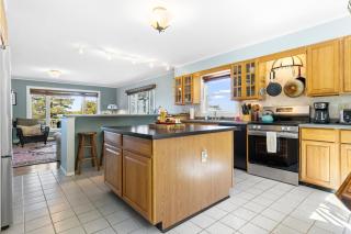 Charming home with stunning bay views, sunroom, gazebo, deck, & grill - 1