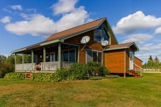 Two lakefront dog-friendly cabins on four acres with porches, dock, & lake views - 8