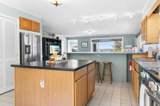 Charming home with stunning bay views, sunroom, gazebo, deck, & grill - 2