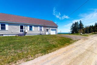 Tranquil getaway on the coast with beach access, ocean views, & screened porch - 0
