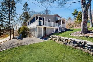 Dog-friendly river-view home with wood stove, deck, patio, dock, beach, grill - 9