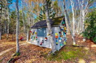 Charming riverfront home with cozy interiors, dock, and scenic deck views - 8