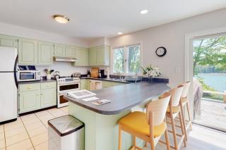 Water-view retreat with beach access, deck, grill, EV charger & lawn games - 3