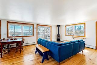 Dog-friendly river-view home with wood stove, deck, patio, dock, beach, grill - 6