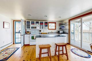 Dog-friendly river-view home with wood stove, deck, patio, dock, beach, grill - 2