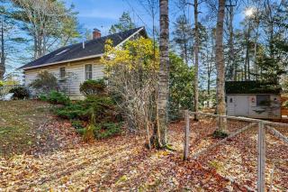 Charming riverfront home with cozy interiors, dock, and scenic deck views - 9