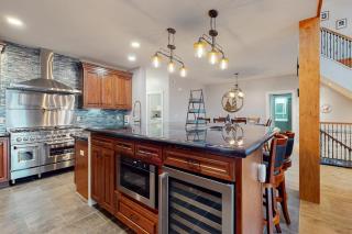 Luxurious waterfront home with deck, firepit, hot tub, fireplace, & pool table - 1