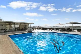 Sophistication Stay-Cation with a Roof Top Pool! - 8