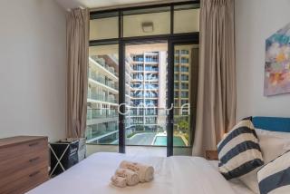 Comfortable 1BR Apartment with Relaxing Pool View - 4