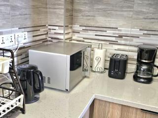 metro living retreat apartment with heated swimming pool,fully equipped gym ,ample parking space and a relaxing rooftop with breathtaking views - 3
