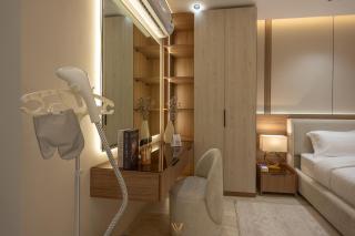 Velora Living Royal 2BR Apartment 70 TV - 1