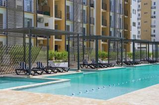 Luxury 2BR with Resort Pool, Balcony Swings, High-Speed WiFi & Near PUJ Airport - 6