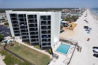 Beachfront with a pool at Ocean Trillium Condo ~ 101 - 9