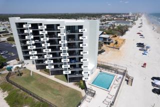 Beachfront with a pool at Ocean Trillium Condo ~ 101 - 2