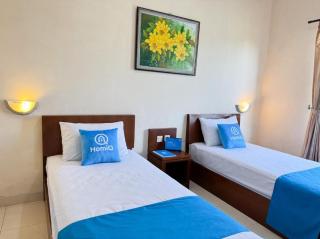 Adiputra Guesthouse Tata Bumi by HomiQ - 2