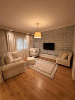 Spacious 2-BR Apartment with Private Garden Patio in Madinaty - 9