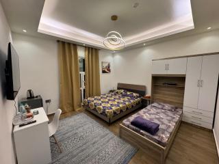 Entire 2-Bedroom Apartment near Abu Dhabi Airport - 1