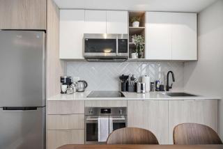 Sleek 2BR Condo with Balcony & Skyline Views - 7