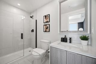 Sleek 2BR Condo with Balcony & Skyline Views - 4