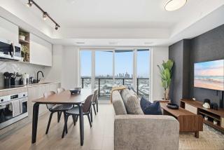 Sleek 2BR Condo with Balcony & Skyline Views - 1