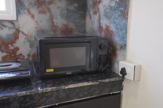 RD Haven Zirakpur Cozy 1BHK Nr Airport AC KIT PRKG No Smoking - 7