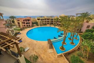 Lovely first floor tow bed rooms overviewing circular pool for families only in Talabay Aqaba - 4