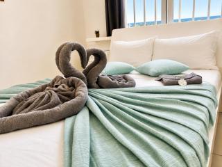 Beach Breeze Bliss - A Radiant Coastal Apartment - 1