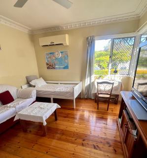 Private living room with a single bed - 0