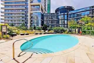 Cozy 2BR 2BA Condo Steps to Subway Pool and Gym - 1