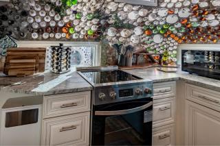 Whimsical Earth House with Colorful Bottle Architecture Near Saguaro National Park in Tucson, Arizona - 3