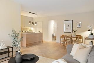 Modern and centrally located apartment with 2 bedrooms and a garage space with EV charger - 0