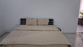 Spacious bedroom with a patio attached - 8